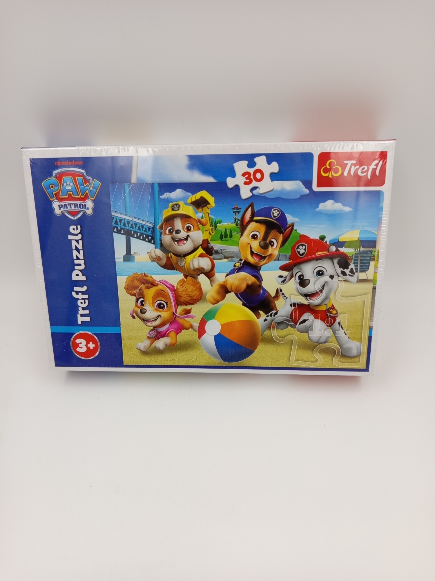 puzzle Psi Patrol Trefl 30 elementów – Chase, Marshall, Rubble i Skye na plaży